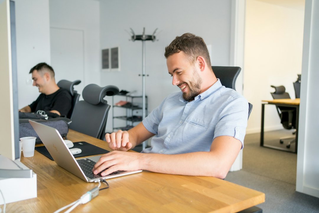 Office worker using a computer representing managed IT support