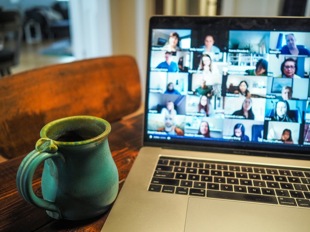Laptop video meeting representing business video conferencing